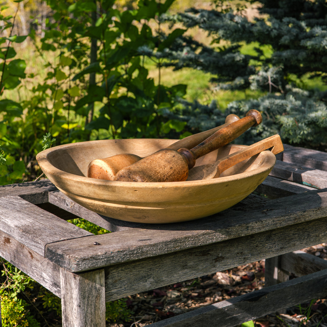 Antique wooden butter bowl with paddle