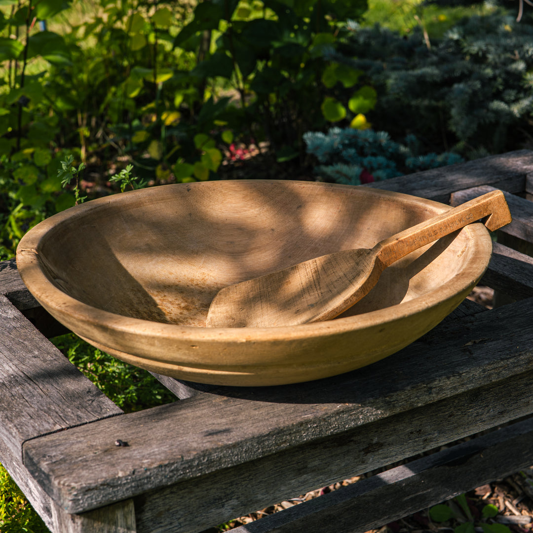Antique wooden butter bowl with paddle