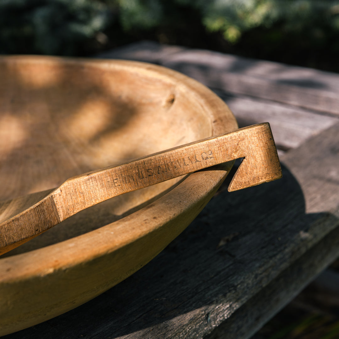 Antique wooden butter bowl with paddle