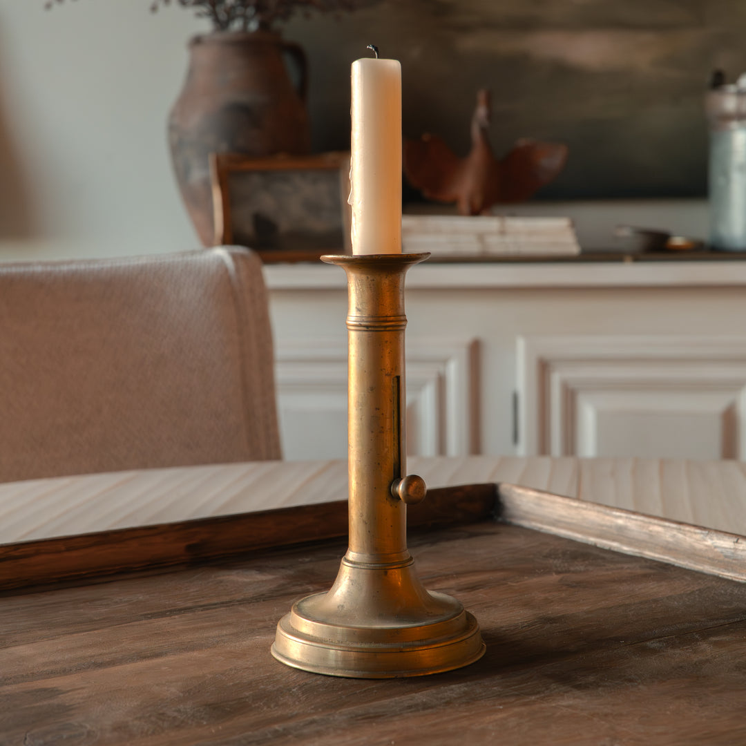 Antique brass push-up candlestick