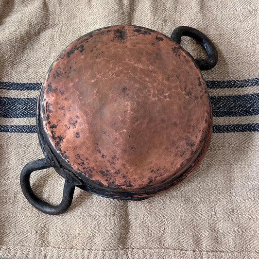 Hand-hammered antique French copper cookware with forged iron handles. (c. 1880-1920)