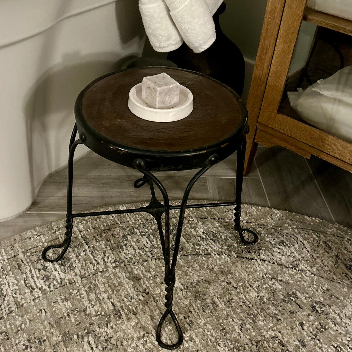 Vintage wrought-iron and leather footstool