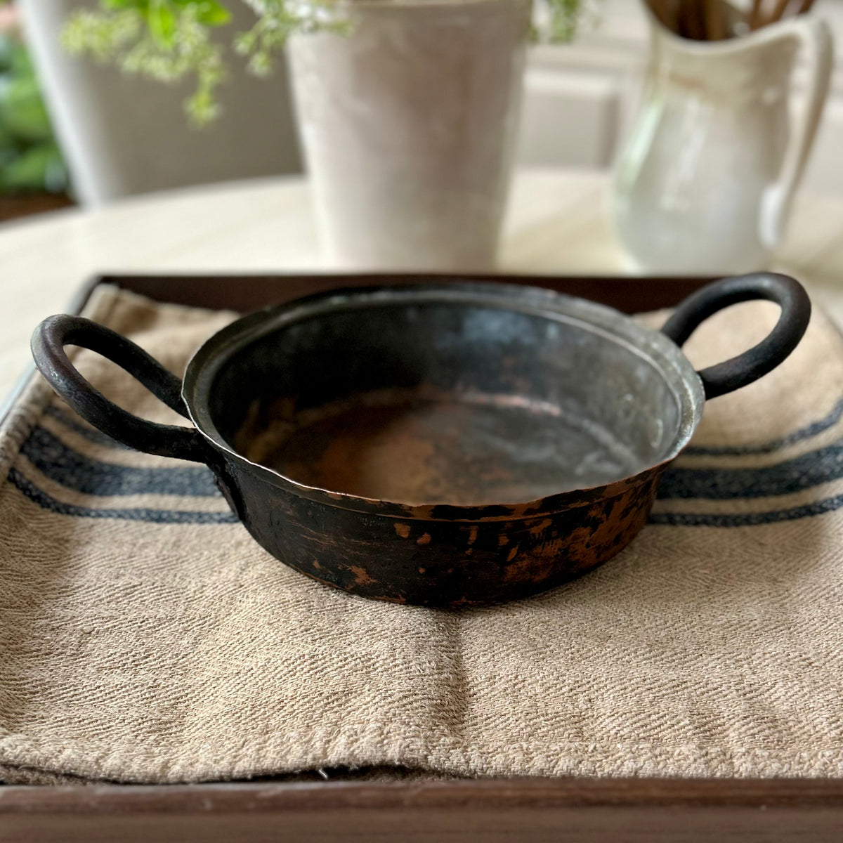 Hand-hammered antique French copper cookware with forged iron handles. (c. 1880-1920)