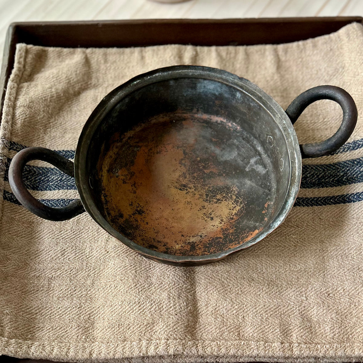 Hand-hammered antique French copper cookware with forged iron handles. (c. 1880-1920)