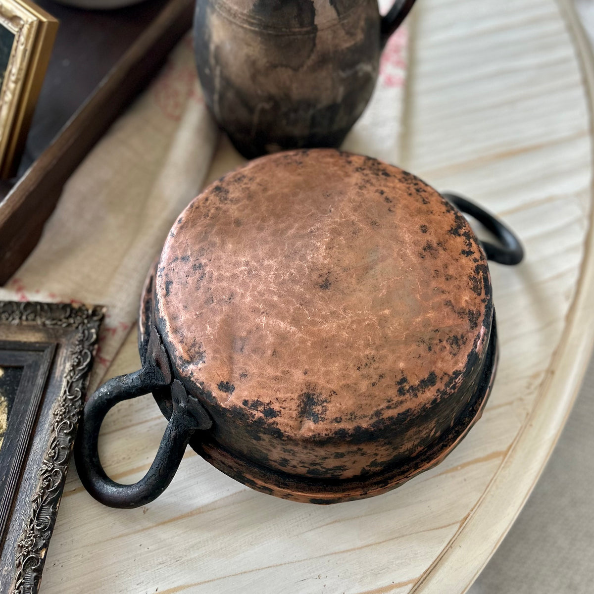 Hand-hammered antique French copper cookware with forged iron handles. (c. 1880-1920)