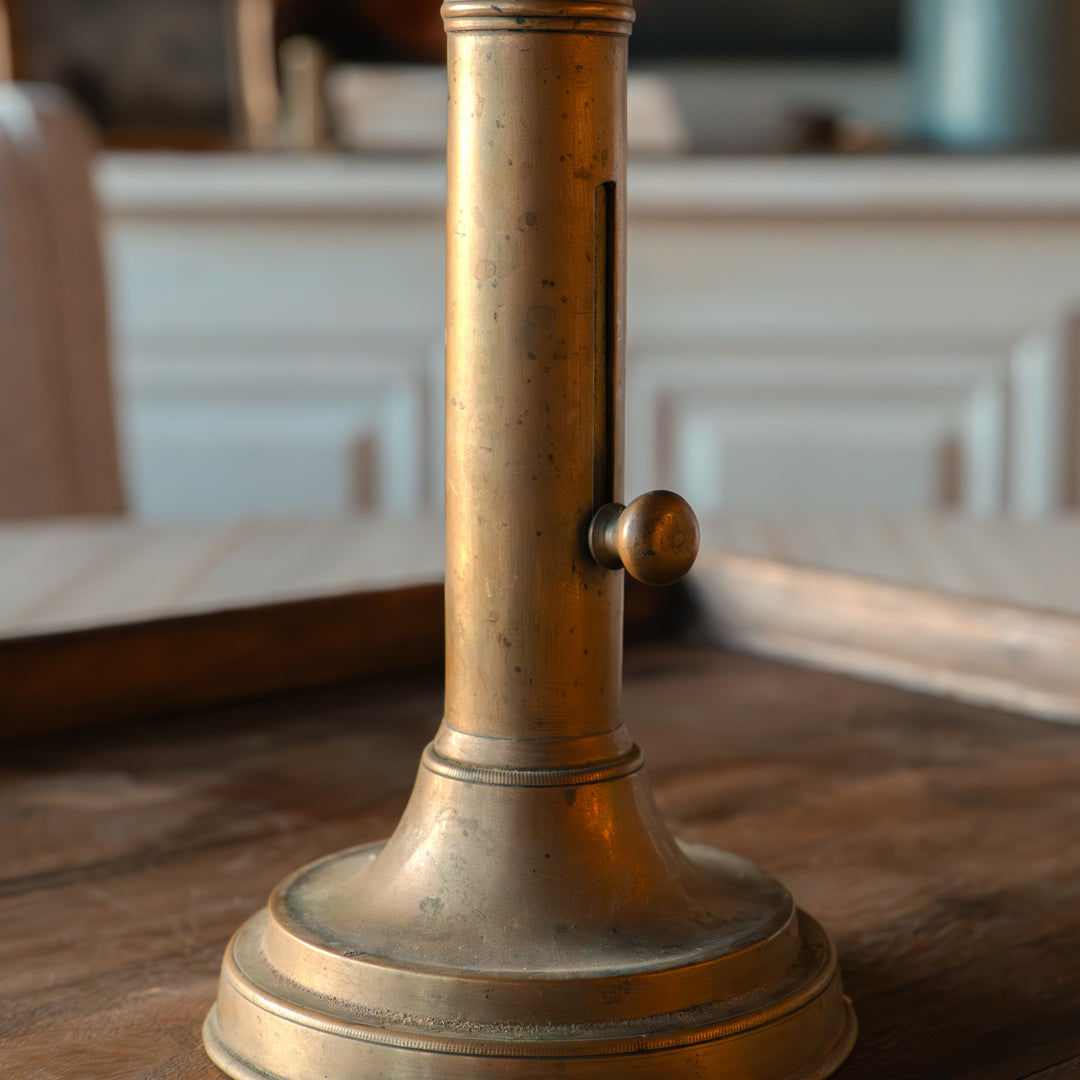 Antique brass push-up candlestick