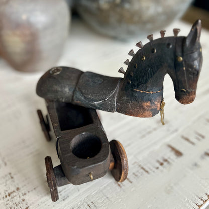 Antique folk art wooden horse on wheels