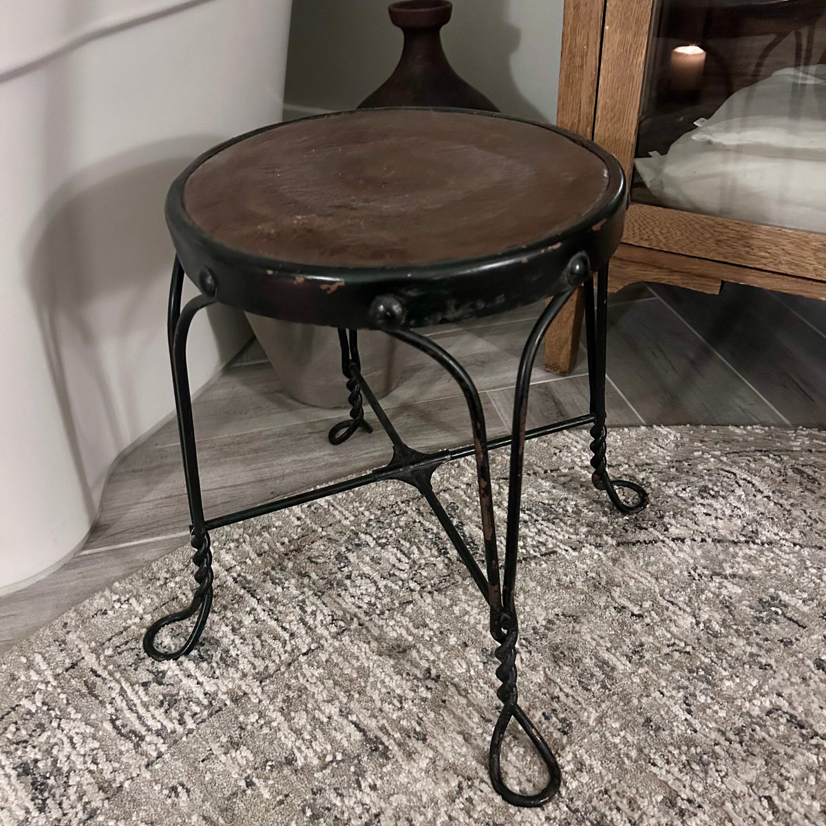 Vintage wrought-iron and leather footstool