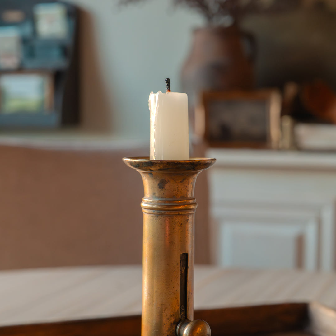 Antique brass push-up candlestick