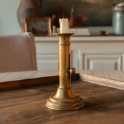 Antique brass push-up candlestick