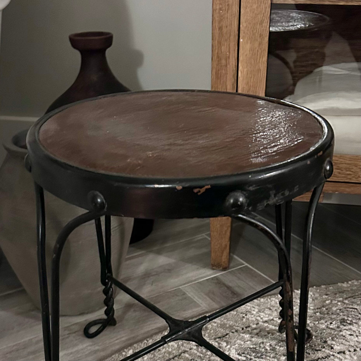 Vintage wrought-iron and leather footstool