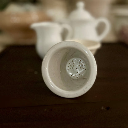 Vintage porcelain tea strainer
