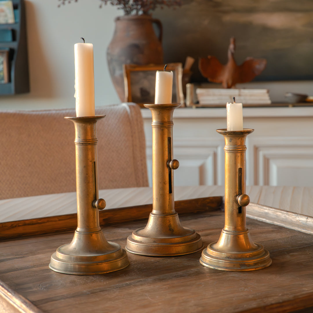 Antique brass push-up candlestick