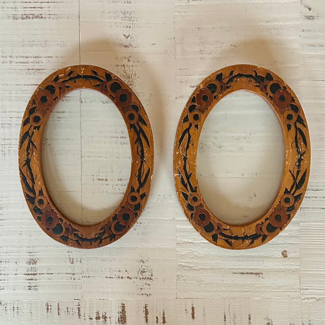 Pair of hand painted wooden oval frames