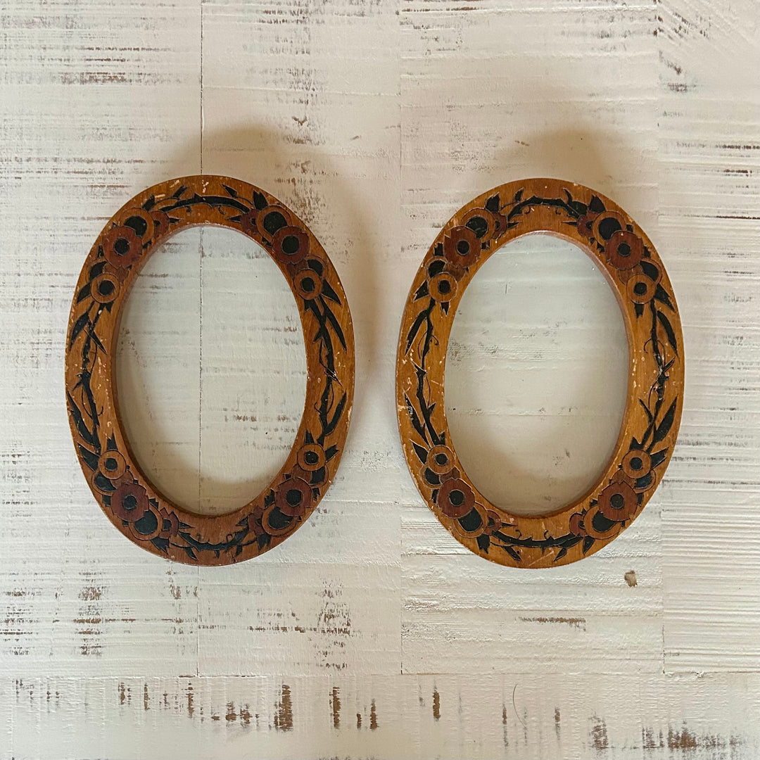 Pair of hand painted wooden oval frames