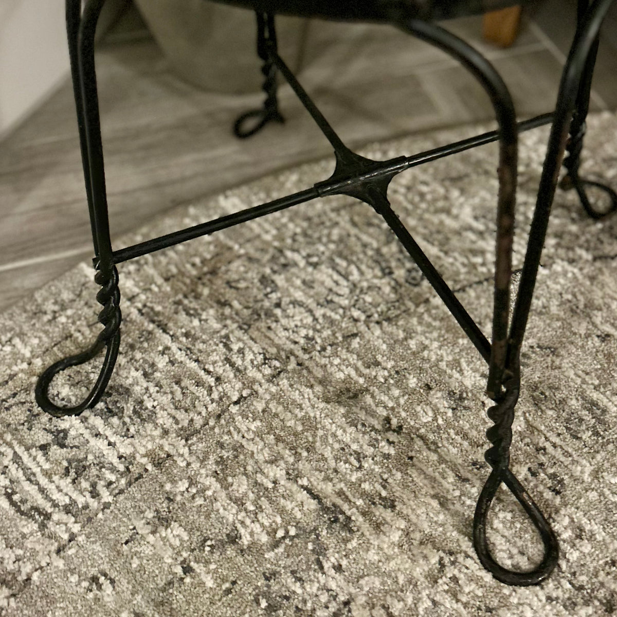 Vintage wrought-iron and leather footstool