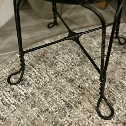Vintage wrought-iron and leather footstool