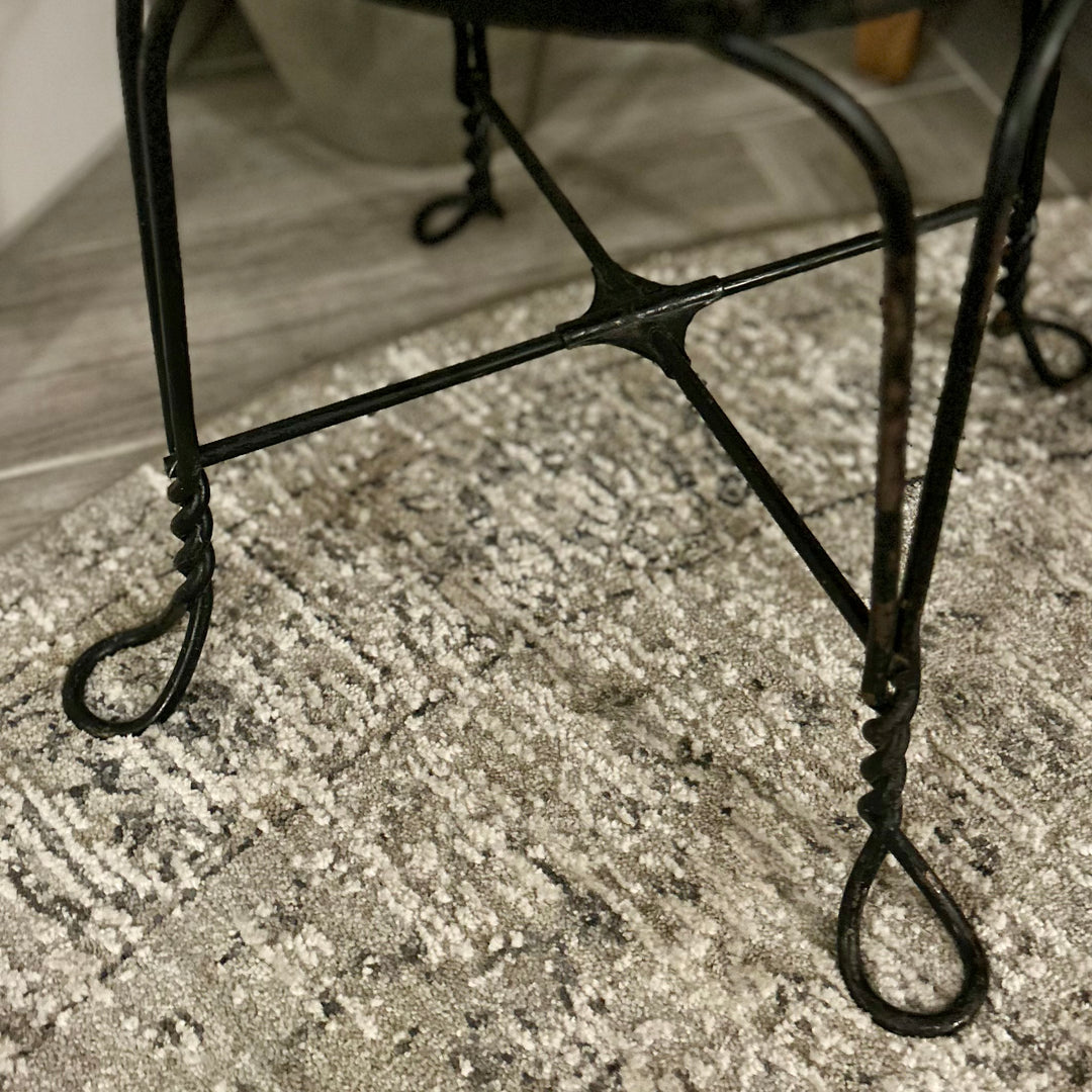 Vintage wrought-iron and leather footstool
