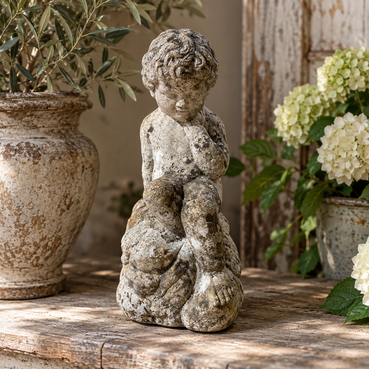 Early 20th Century Weathered Cast Stone Garden Figure