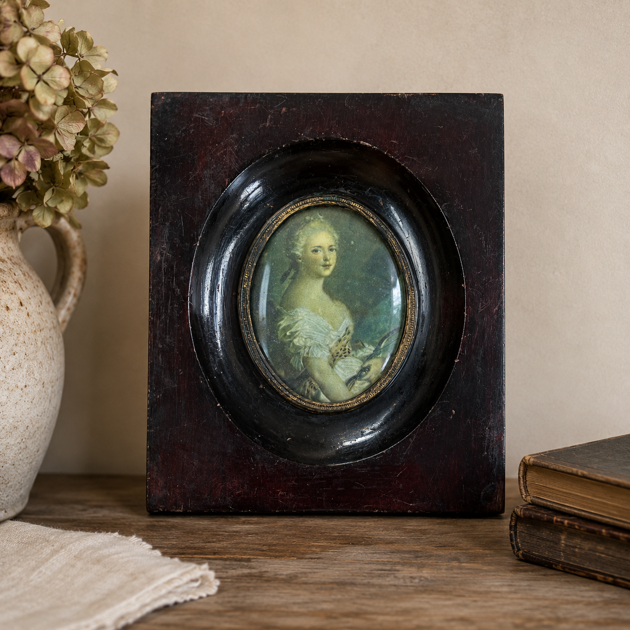 Pair of Vintage Petite Portraits in Ebonized Convex Glass Frames