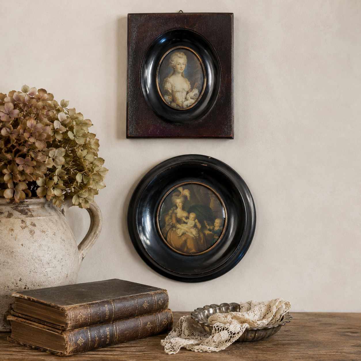 Pair of Vintage Petite Portraits in Ebonized Convex Glass Frames